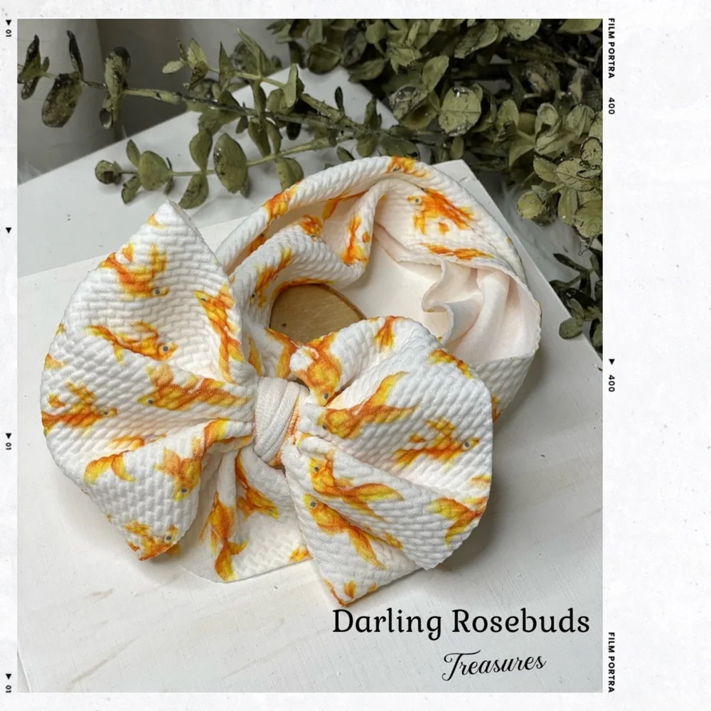 Goldfish bow headband for newborn up to 4 years ago old approximately.